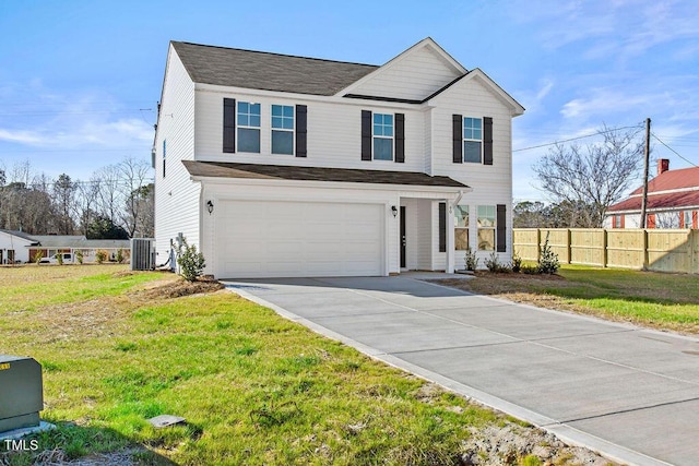 front of property featuring a front lawn, a garage, and central AC unit