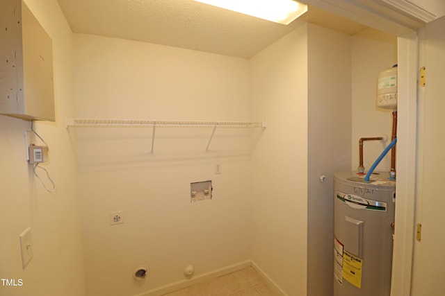 clothes washing area featuring hookup for an electric dryer, electric water heater, and hookup for a washing machine