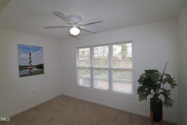 empty room with carpet and ceiling fan