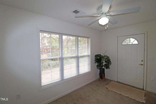 entryway featuring carpet flooring and ceiling fan