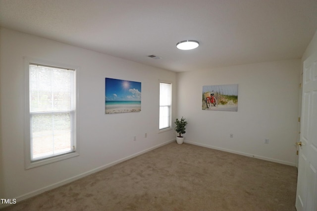 unfurnished room with carpet floors