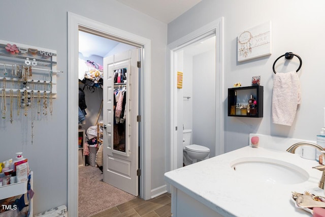 bathroom with vanity and toilet