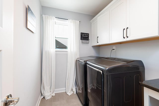 laundry room with cabinets and independent washer and dryer