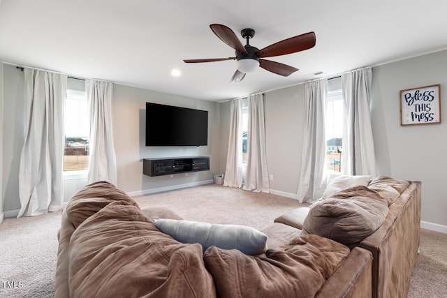 living room with ceiling fan and light carpet