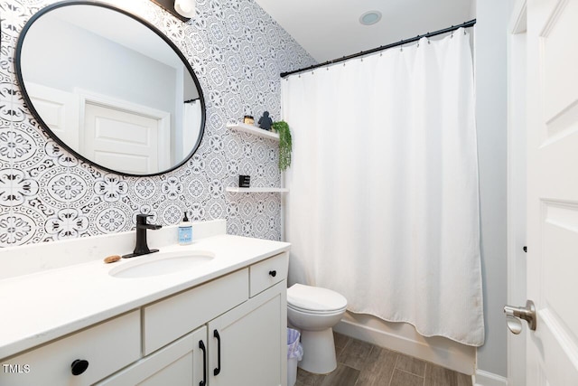 full bathroom with vanity, toilet, and shower / bath combo with shower curtain