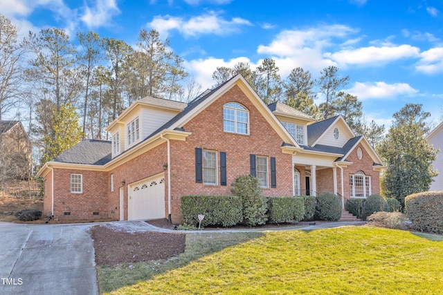 view of property featuring a front yard and a garage