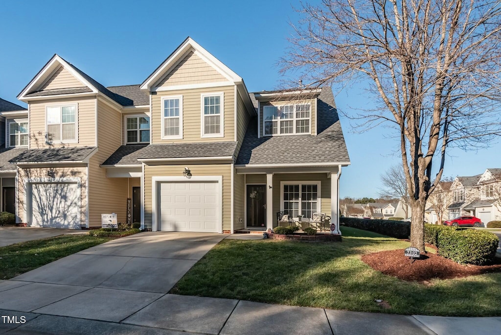 view of front of house featuring a garage and a front yard