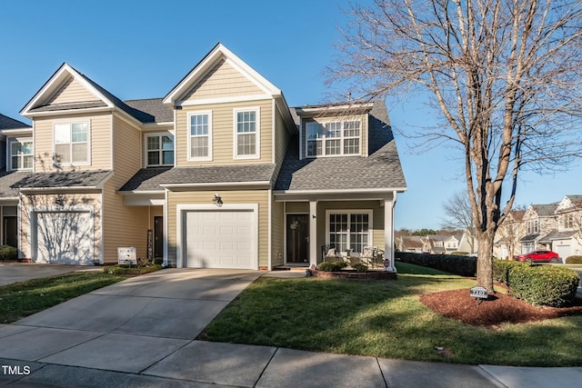 view of front of house featuring a garage and a front yard