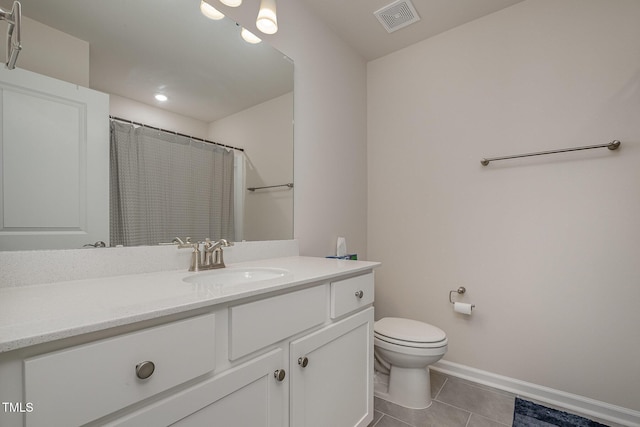 bathroom with toilet, vanity, tile patterned flooring, and a shower with curtain