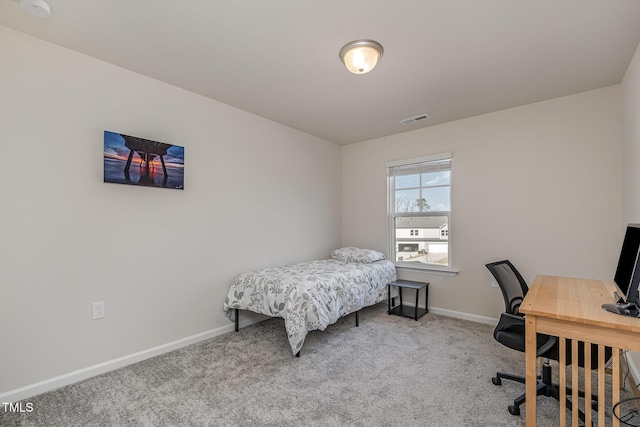 bedroom featuring light colored carpet