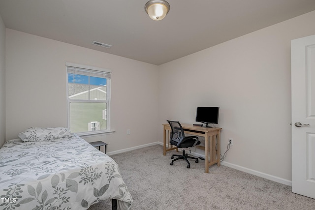 bedroom with light colored carpet