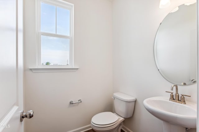 bathroom with sink and toilet