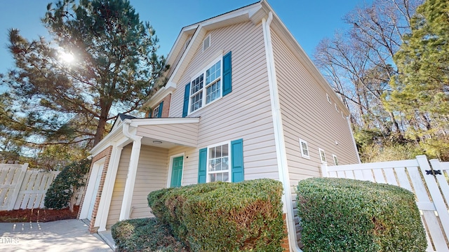 view of side of home featuring a garage