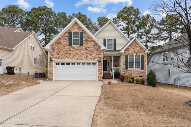 view of front of property with crawl space, cooling unit, driveway, and a garage