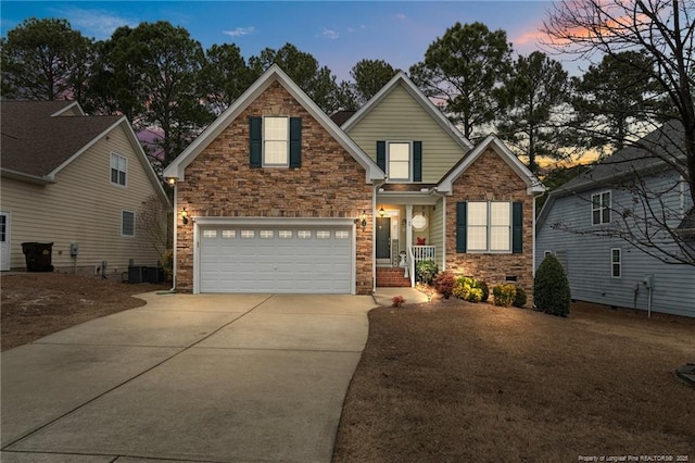 view of front of home with crawl space, a garage, and driveway