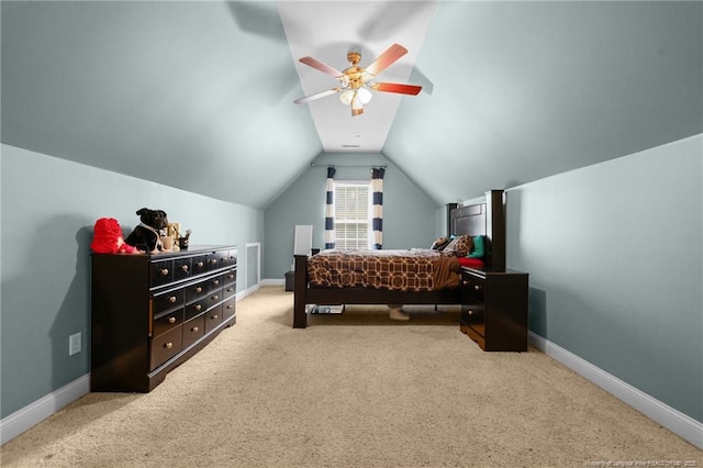 bedroom with vaulted ceiling, baseboards, and light carpet