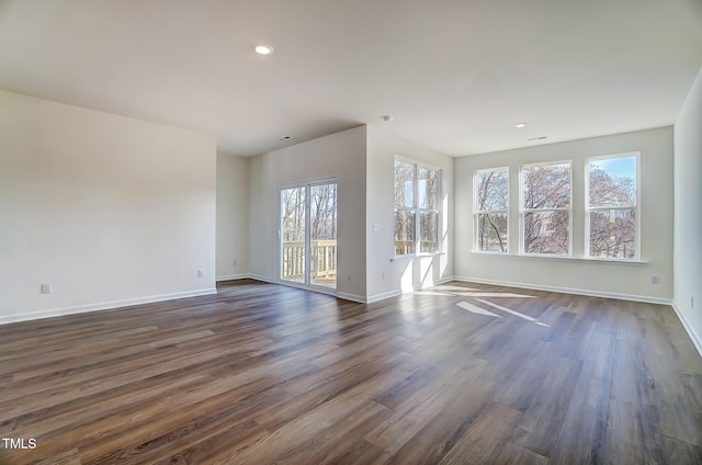 851 Parc Townes Dr Unit 10, Wendell, NC 27591 - spare room with dark hardwood / wood-style floors and a healthy amount of sunlight