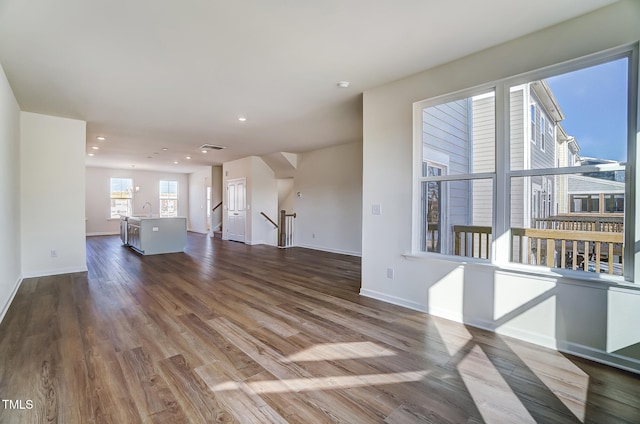 851 Parc Townes Dr Unit 10, Wendell, NC 27591 - unfurnished living room with sink and hardwood / wood-style floors