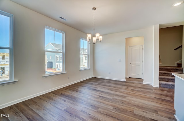 851 Parc Townes Dr Unit 10, Wendell, NC 27591 - unfurnished dining area featuring a notable chandelier and light hardwood / wood-style floors