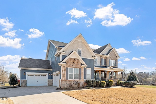 craftsman inspired home featuring a garage and a porch