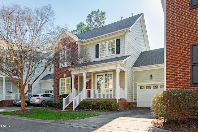 view of front of house featuring covered porch and a garage