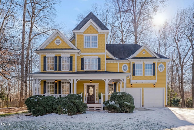 view of front of house featuring a garage and a porch