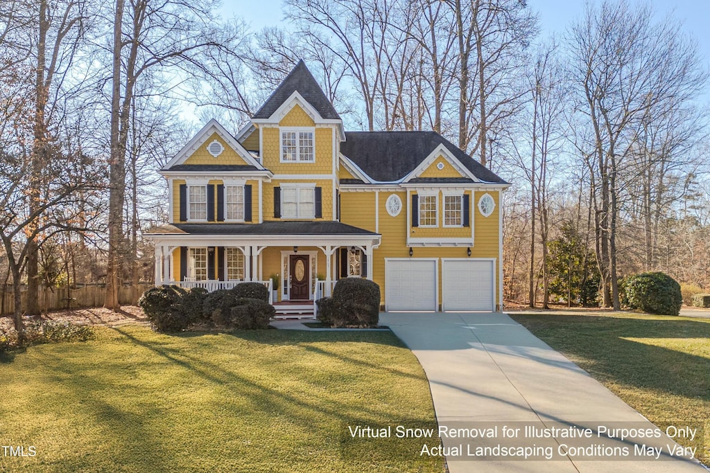 view of front of property featuring a garage, covered porch, and a front lawn