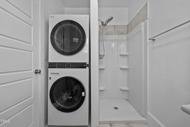 laundry area with stacked washing maching and dryer