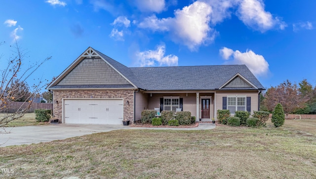 view of front of house with a garage and a front lawn