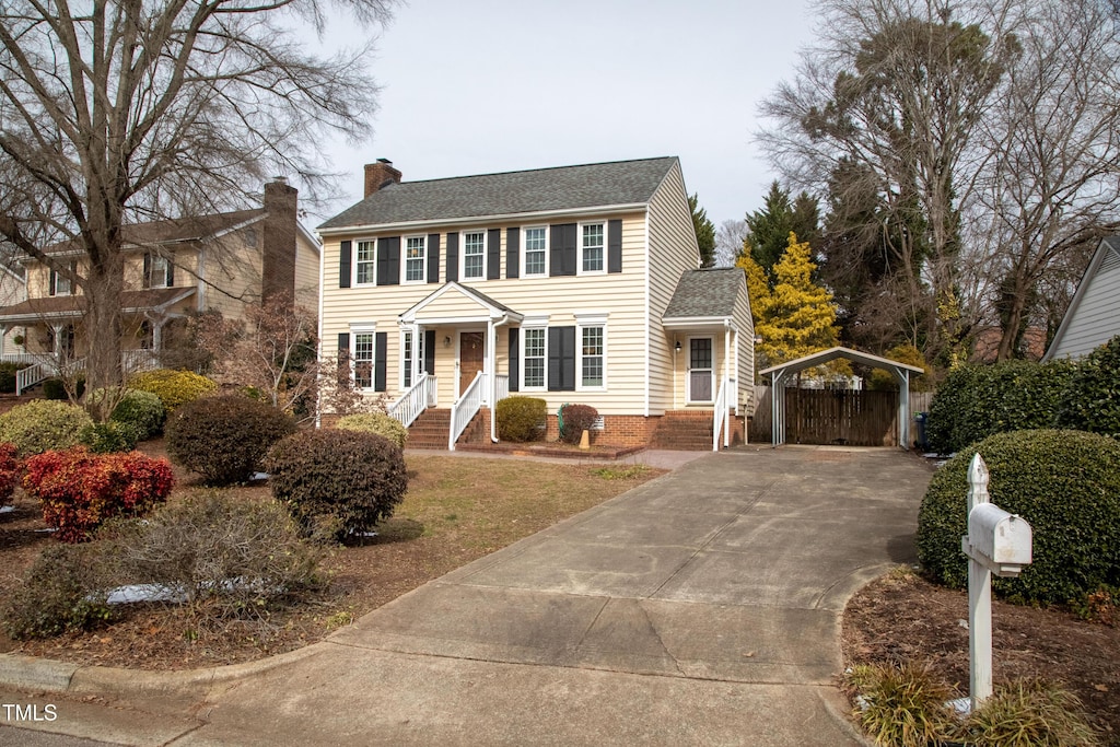 colonial-style house with a carport