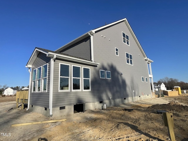 view of home's exterior featuring crawl space