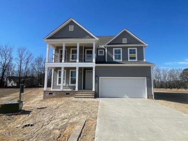 view of front of property featuring a garage, driveway, a porch, and crawl space