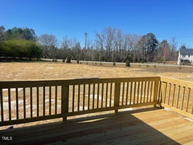 85 N Stagecoach Dr, Wendell, NC 27591 - wooden deck featuring view of wooded area