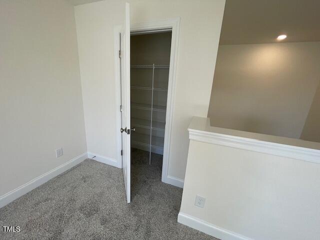 85 N Stagecoach Dr, Wendell, NC 27591 - unfurnished bedroom with a spacious closet, baseboards, carpet, a closet, and recessed lighting