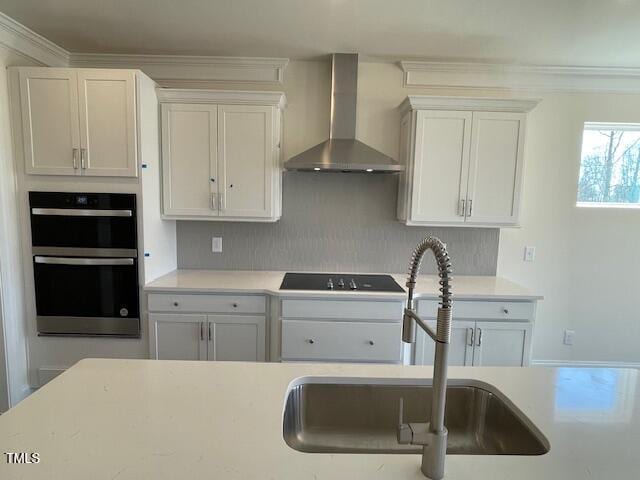 85 N Stagecoach Dr, Wendell, NC 27591 - kitchen featuring wall chimney range hood, a sink, double wall oven, light countertops, and ornamental molding