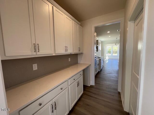 85 N Stagecoach Dr, Wendell, NC 27591 - kitchen featuring light countertops, white cabinets, and dark wood-style floors