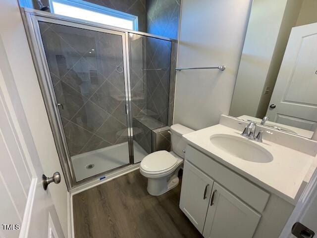 85 N Stagecoach Dr, Wendell, NC 27591 - full bath featuring wood finished floors, a shower stall, toilet, and vanity