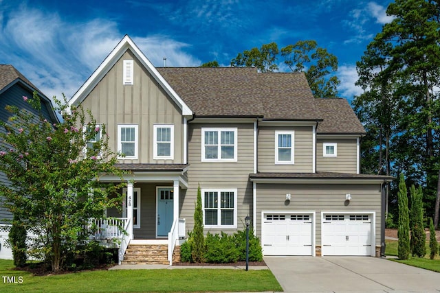 view of front facade featuring a porch and a garage