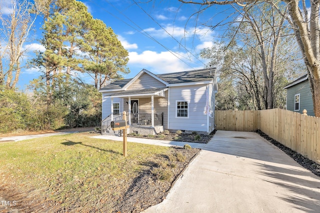 bungalow-style home featuring a front yard and a porch