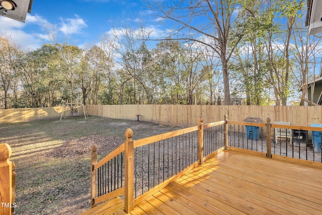 wooden terrace with a playground