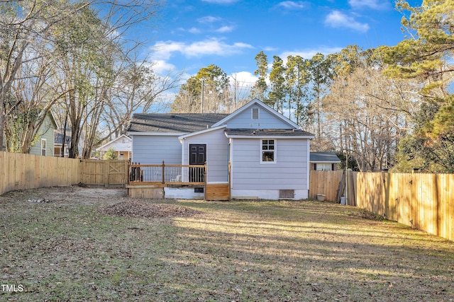 back of house with a yard