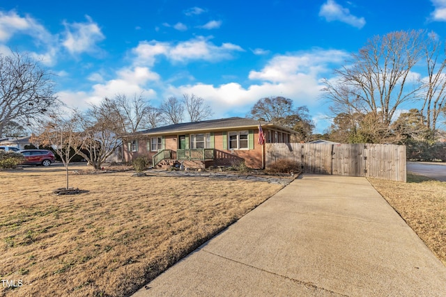 ranch-style home with a front lawn