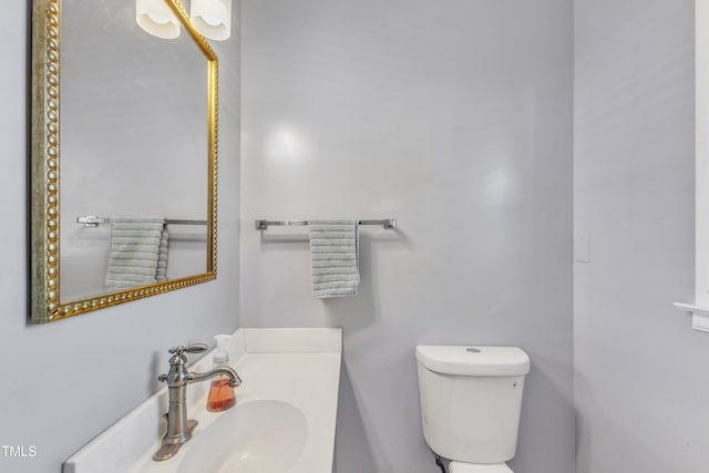 bathroom with toilet and sink