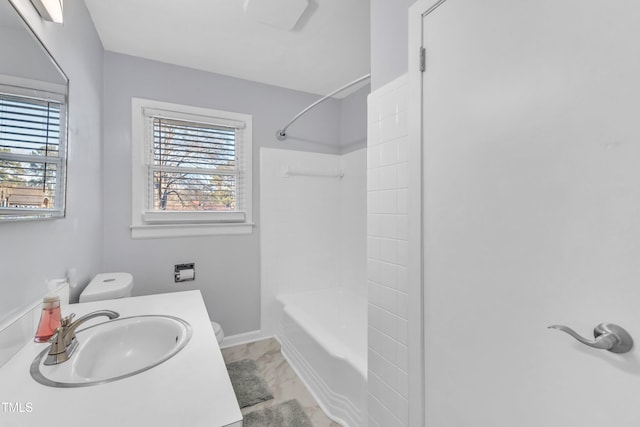 full bathroom featuring vanity, tub / shower combination, and toilet