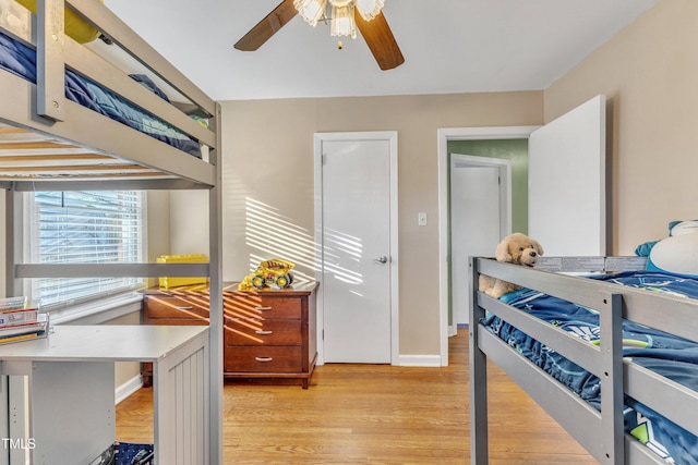 bedroom with light wood-type flooring and ceiling fan