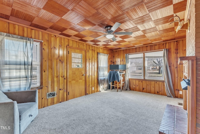 miscellaneous room featuring carpet flooring, ceiling fan, and wooden ceiling