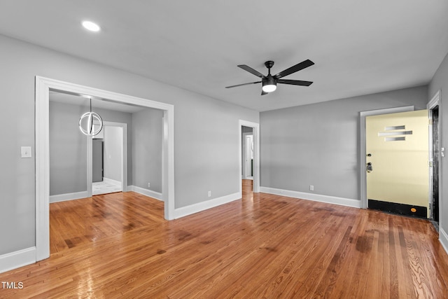 empty room with wood-type flooring and ceiling fan