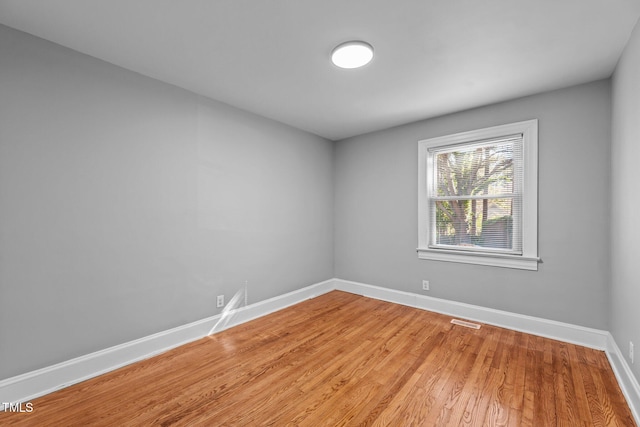 empty room featuring hardwood / wood-style flooring