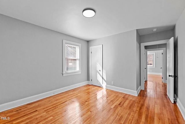 spare room with light hardwood / wood-style flooring