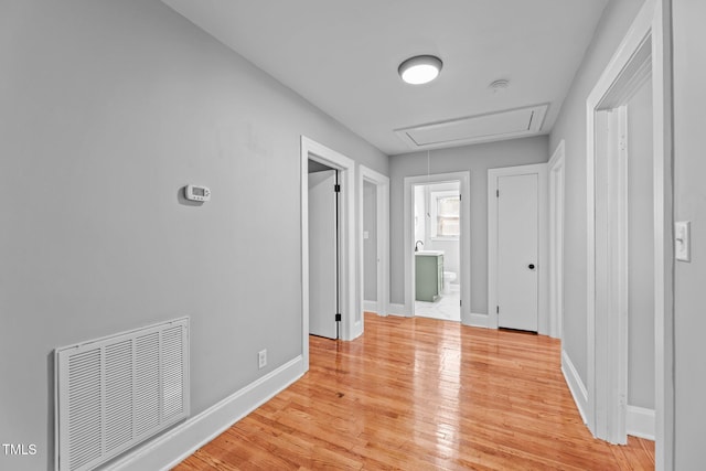 hallway with light wood-type flooring